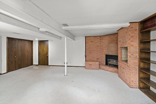 unfurnished living room with beam ceiling, carpet flooring, a fireplace, and baseboards