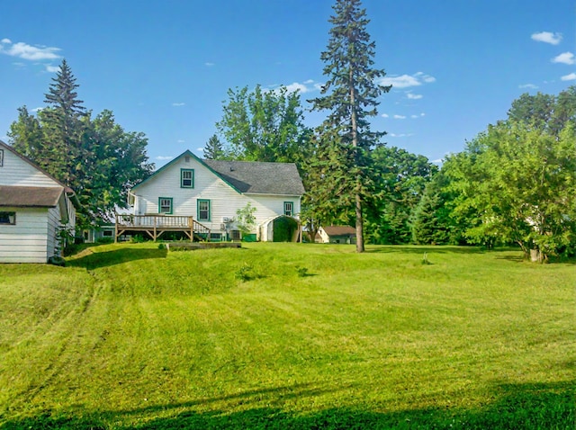 view of yard with a deck