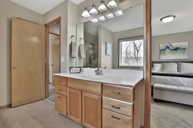 ensuite bathroom featuring ensuite bath, walk in shower, vanity, and tile patterned floors