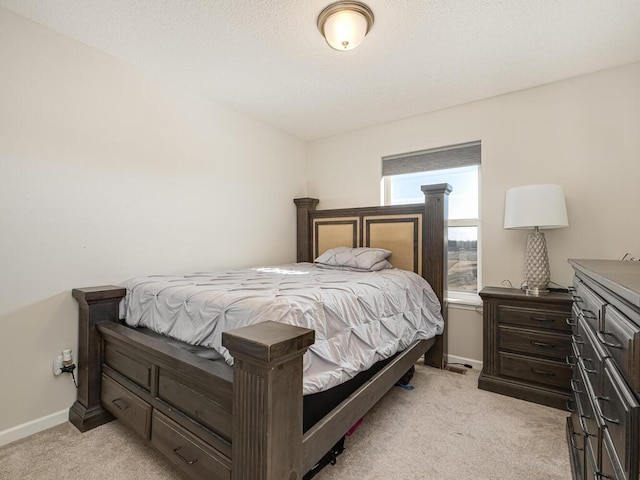 bedroom featuring baseboards and light carpet