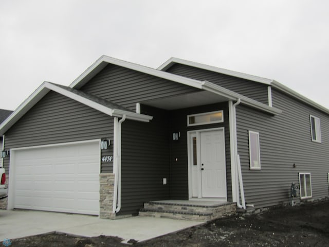 view of front of home with a garage and driveway