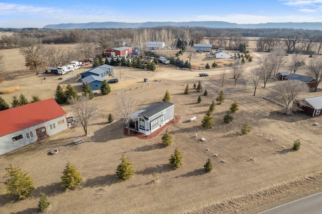 bird's eye view featuring a desert view, a rural view, and a mountain view