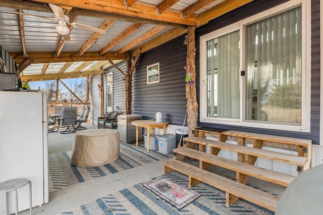 wooden terrace featuring outdoor dining space and ceiling fan