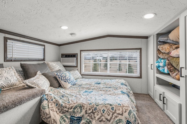 bedroom with carpet floors, a textured ceiling, lofted ceiling, and crown molding