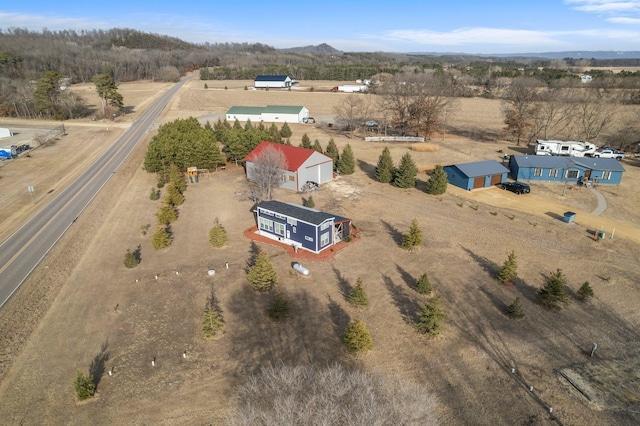 birds eye view of property featuring a mountain view and a rural view