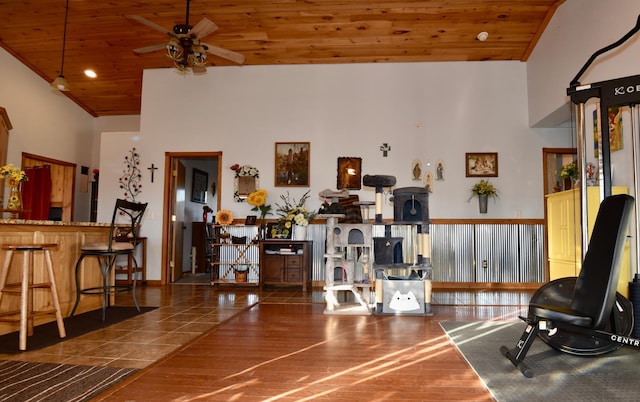 interior space with a ceiling fan, wood ceiling, high vaulted ceiling, and wood finished floors