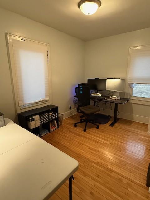 office featuring light wood-style flooring and baseboards