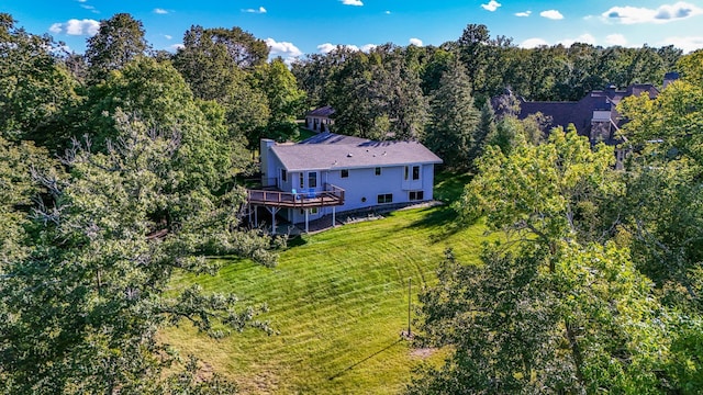 bird's eye view featuring a wooded view