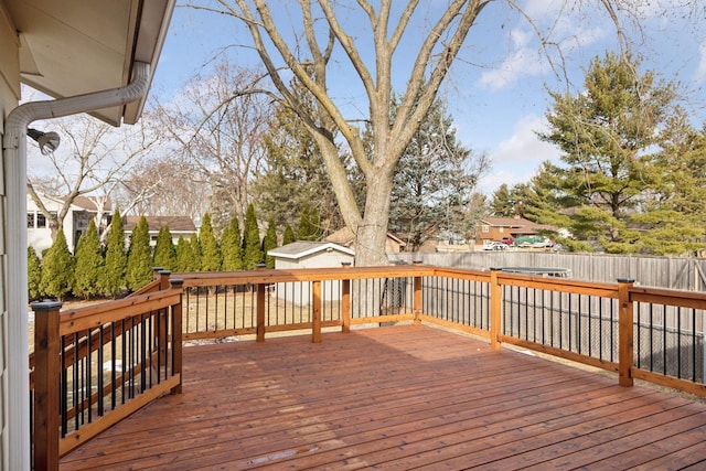 deck with a fenced backyard