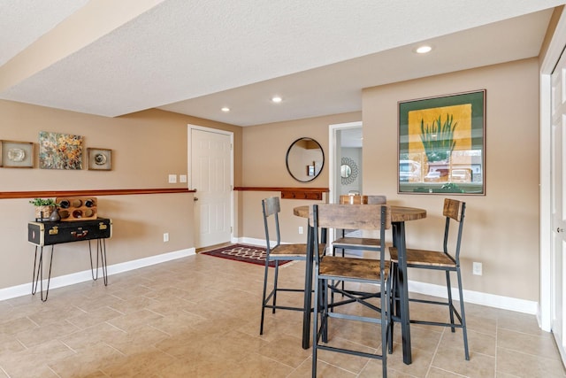 dining room featuring light tile patterned floors, recessed lighting, and baseboards