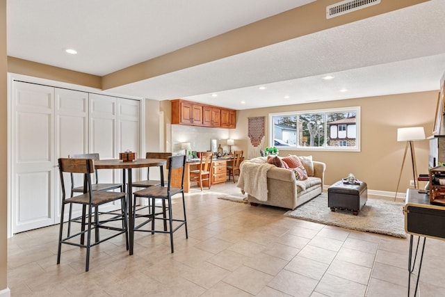 dining area featuring recessed lighting, visible vents, baseboards, and light tile patterned floors