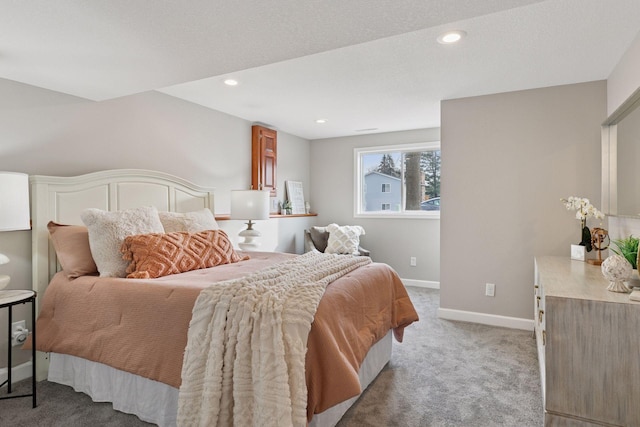 bedroom featuring light carpet, recessed lighting, and baseboards