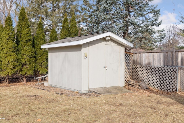 view of shed with fence