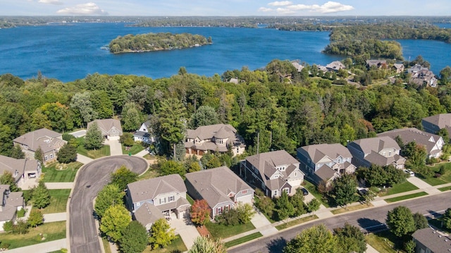 aerial view with a water view and a residential view