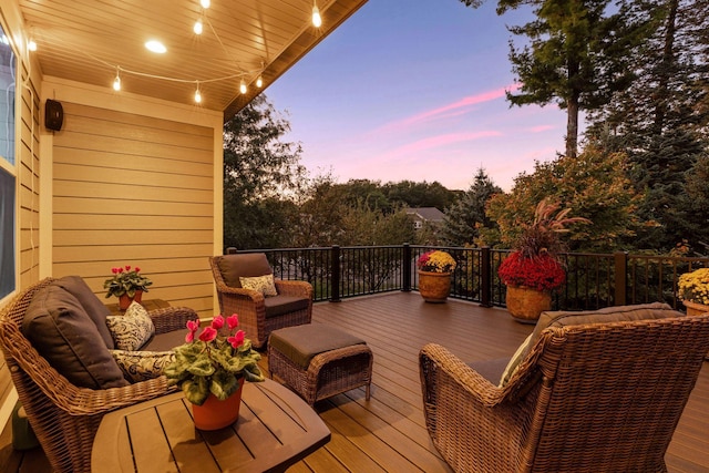 wooden terrace featuring an outdoor living space