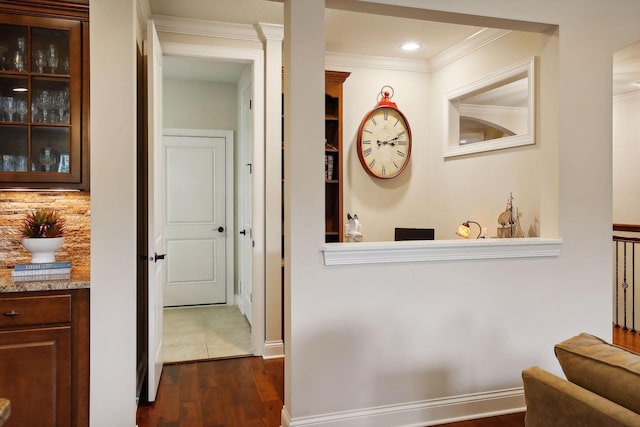 hall featuring ornamental molding, dark wood finished floors, and recessed lighting