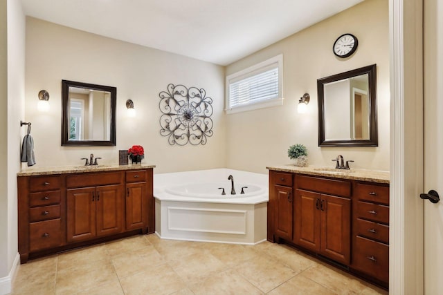 bathroom featuring two vanities, a sink, and tile patterned floors