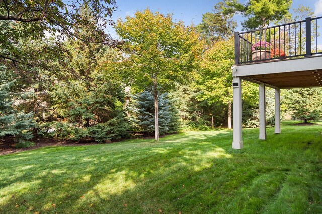 view of yard featuring a wooden deck