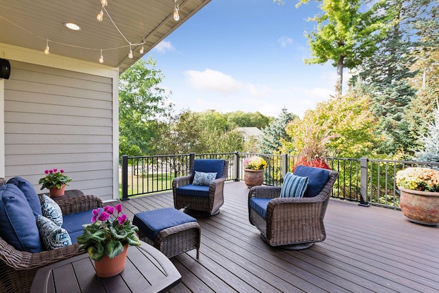 wooden terrace with outdoor lounge area