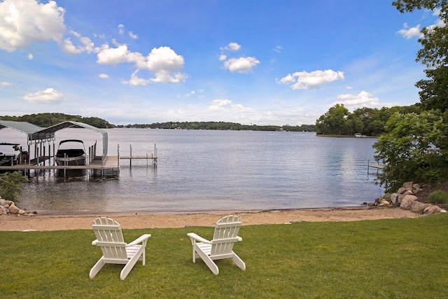 dock area featuring a lawn, a water view, and boat lift