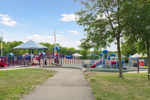 communal playground featuring a lawn