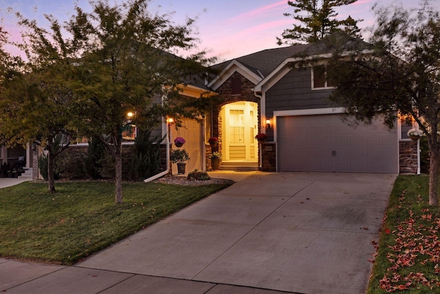 view of front of home with stone siding, a front lawn, and concrete driveway