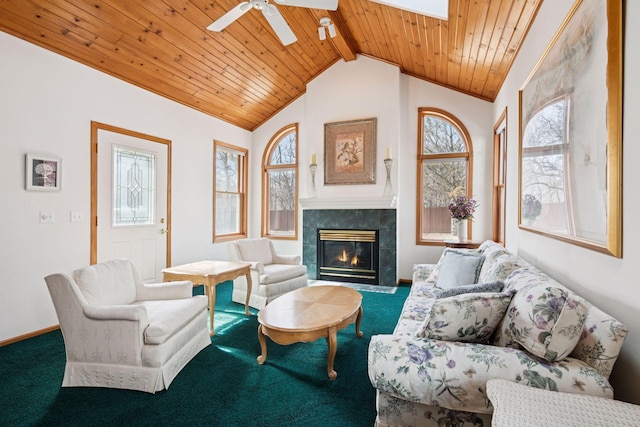 carpeted living room with vaulted ceiling with beams, wood ceiling, a wealth of natural light, and a tile fireplace