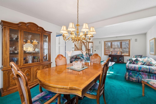 dining room with stairs, carpet floors, and a chandelier