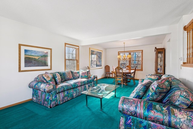 carpeted living room featuring a notable chandelier, baseboards, and a textured ceiling