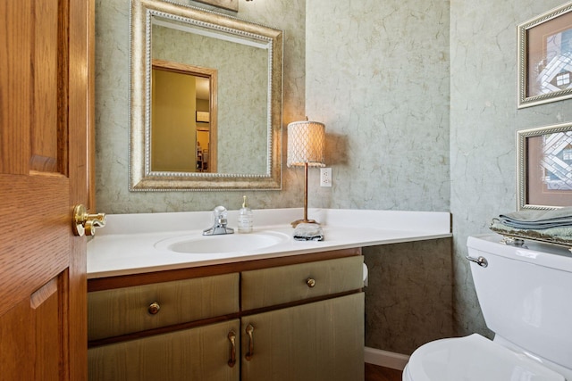 bathroom with vanity and toilet