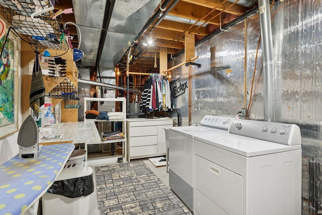 washroom featuring laundry area and washing machine and dryer