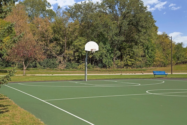 view of sport court with a yard and community basketball court