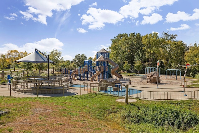 community playground with a lawn and fence