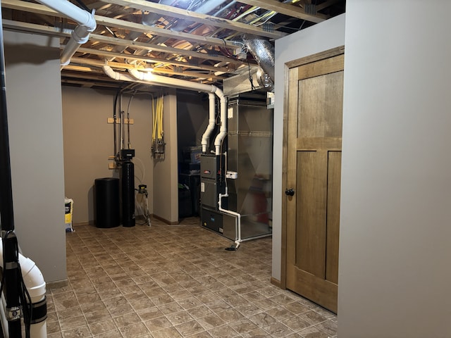 unfinished below grade area featuring heating unit