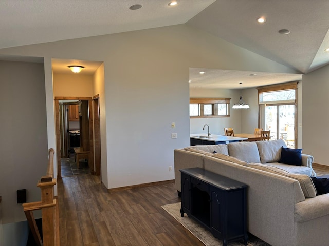 living area featuring vaulted ceiling, dark wood-style flooring, recessed lighting, and baseboards