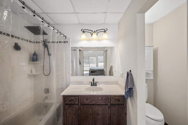 ensuite bathroom featuring shower / bath combo, toilet, ensuite bathroom, vanity, and a paneled ceiling