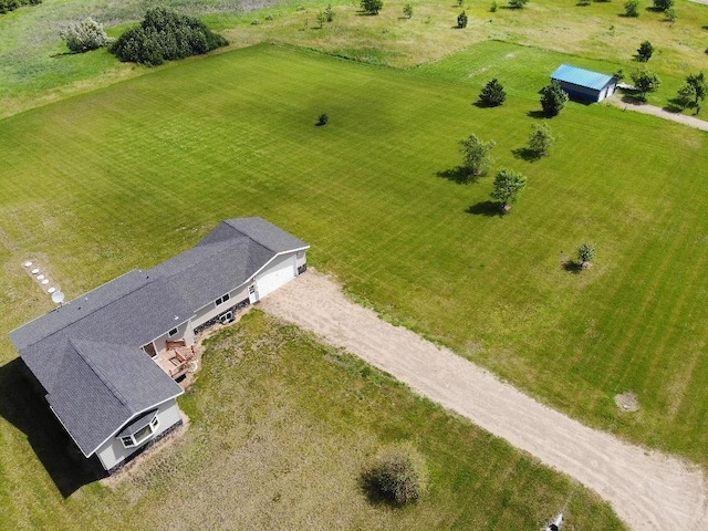 birds eye view of property with a rural view