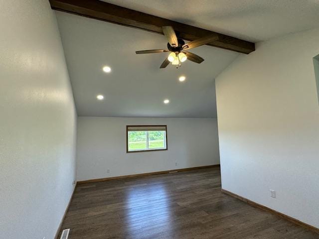 unfurnished room with visible vents, baseboards, a ceiling fan, lofted ceiling with beams, and wood finished floors