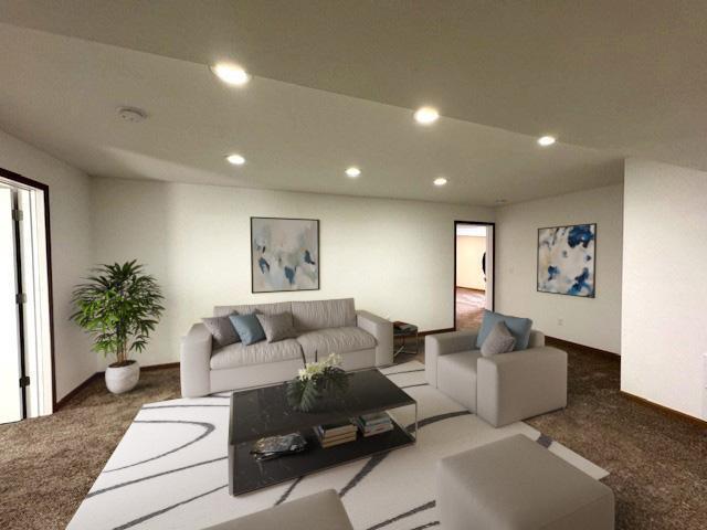 carpeted living room with recessed lighting