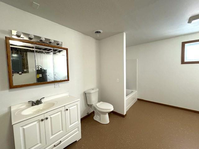 full bathroom with baseboards, visible vents, vanity, and toilet