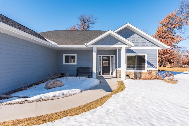 view of front of house featuring roof with shingles