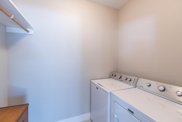 laundry area with laundry area and independent washer and dryer