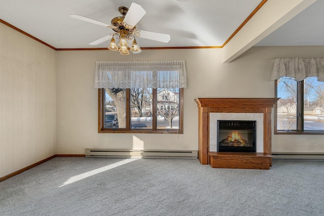 unfurnished living room with ornamental molding, a baseboard radiator, carpet floors, and a high end fireplace