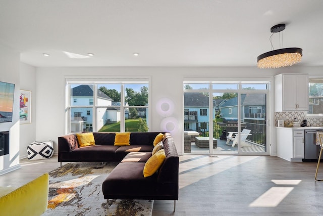 living room with wood finished floors and recessed lighting