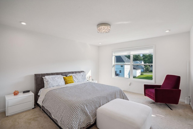 bedroom with recessed lighting, light colored carpet, and baseboards