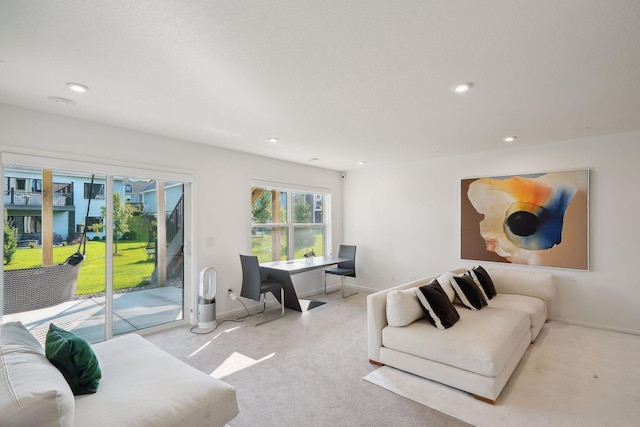 living room with recessed lighting, carpet flooring, and baseboards