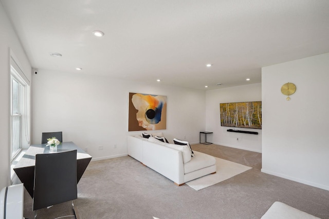 living area with baseboards, carpet, and recessed lighting