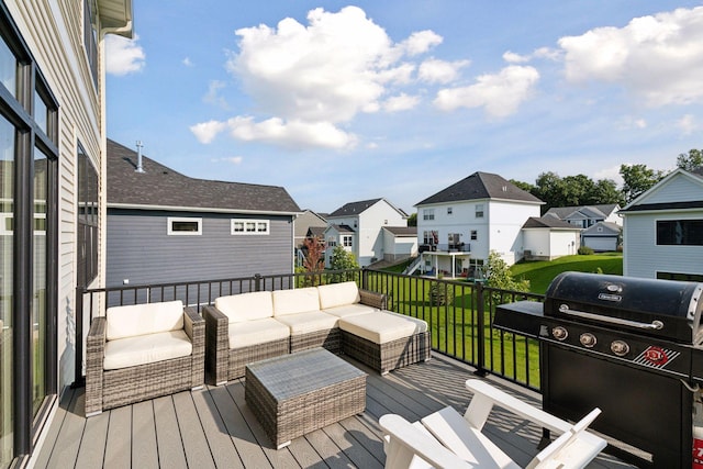 wooden deck featuring a residential view, a lawn, area for grilling, and an outdoor hangout area