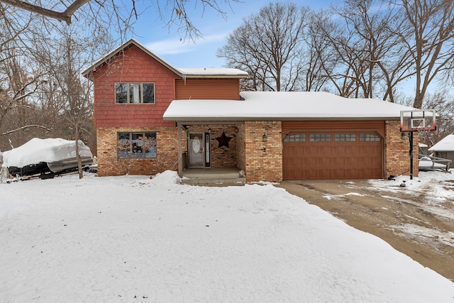 view of front of home with a garage and brick siding