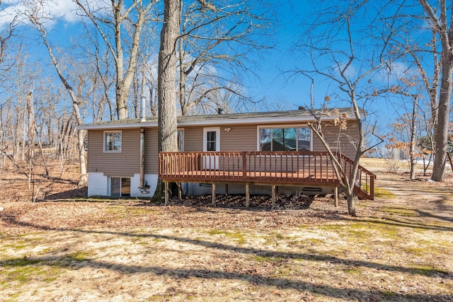 back of house featuring a deck